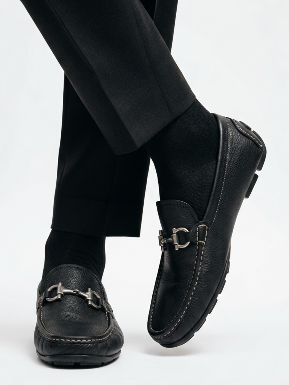 Salvatore Ferragamo men’s black leather loafers with silver buckle